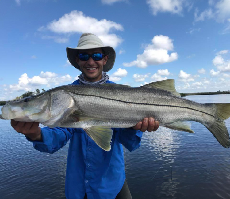 Relaxed moment of a fisherman with a catch