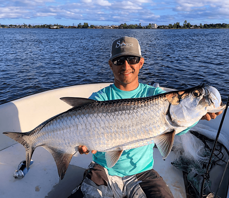 Fisherman with a catch during a Miami fishing trip