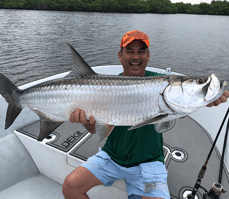 Fisherman with a large catch on a sunny day