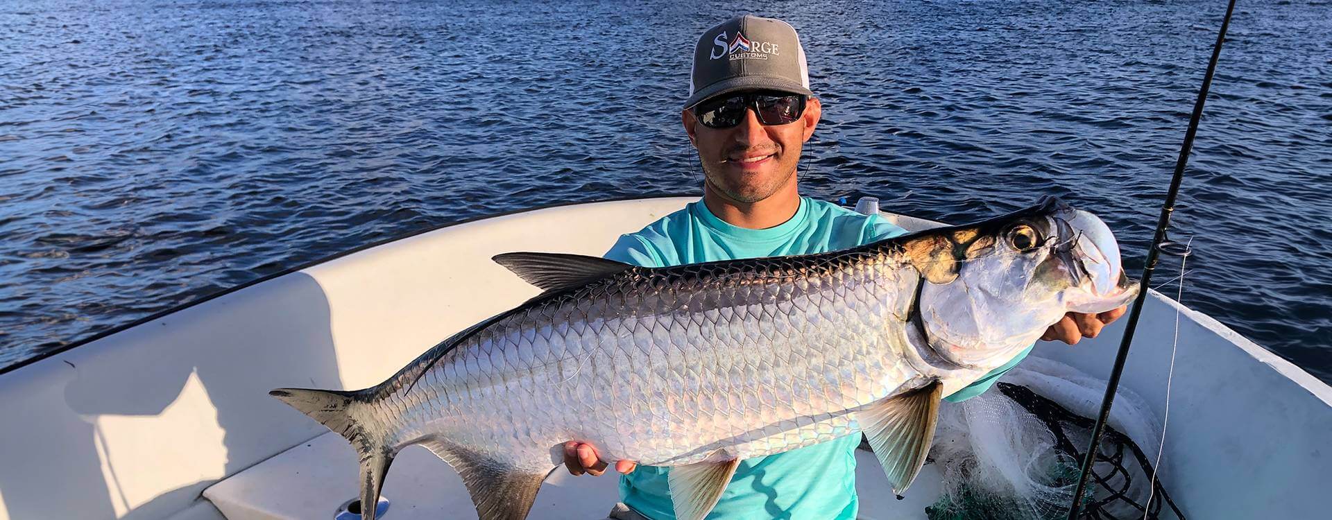 Fisherman with a catch during a Miami fishing trip