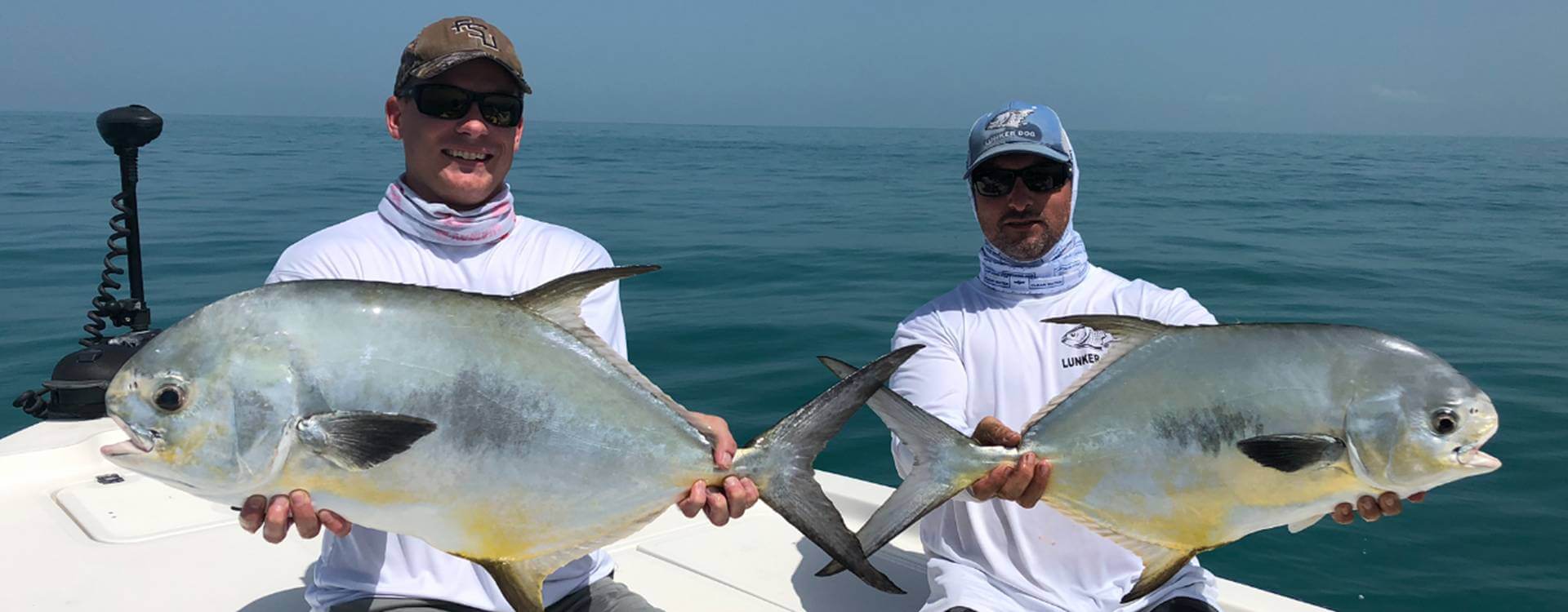 Two fishermen with their catch on a Lunkerdog charter