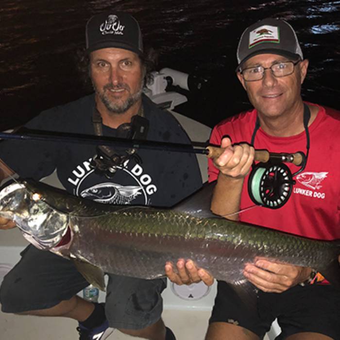 Two fishermen with a catch and gear in Fort Lauderdale