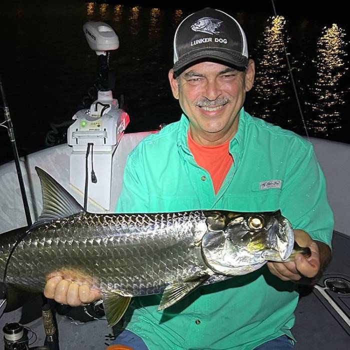 Fisherman with a catch in the vibrant Miami waters