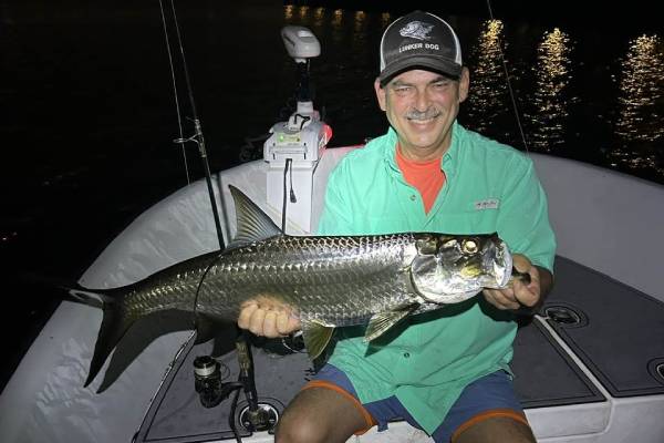 Fisherman with a catch on a South Florida charter