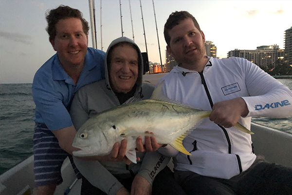 Group of anglers with a catch on a Miami fishing trip