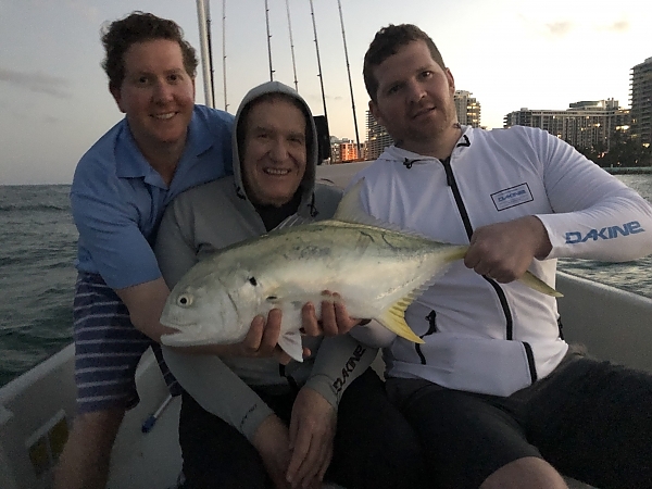 Two fishermen with their catch in Miami