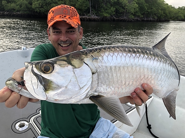 Fisherman with a catch aboard a Lunkerdog boat in Fort Lauderdale