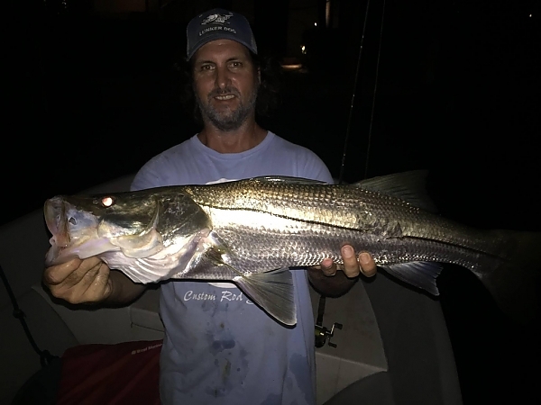 Fisherman displaying a catch in Fort Lauderdale