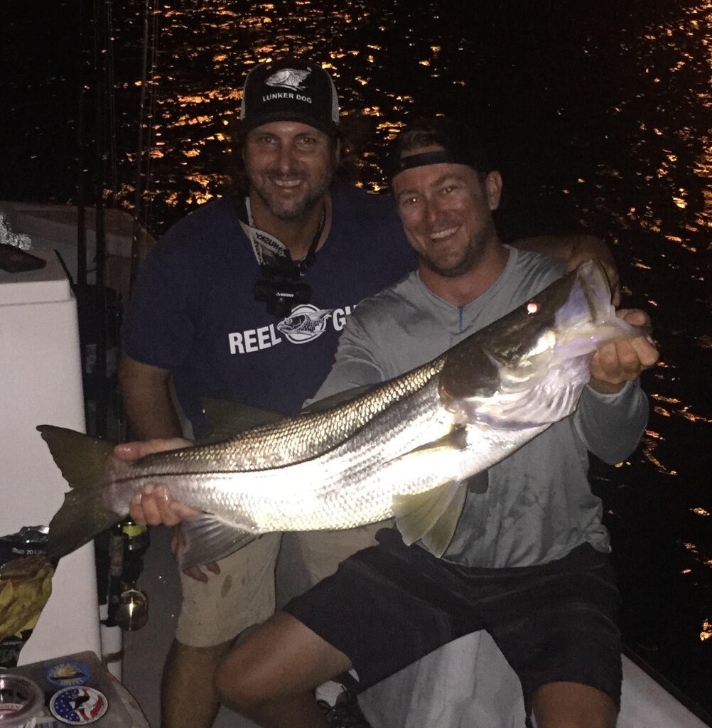 Fisherman with a catch during a Miami charter