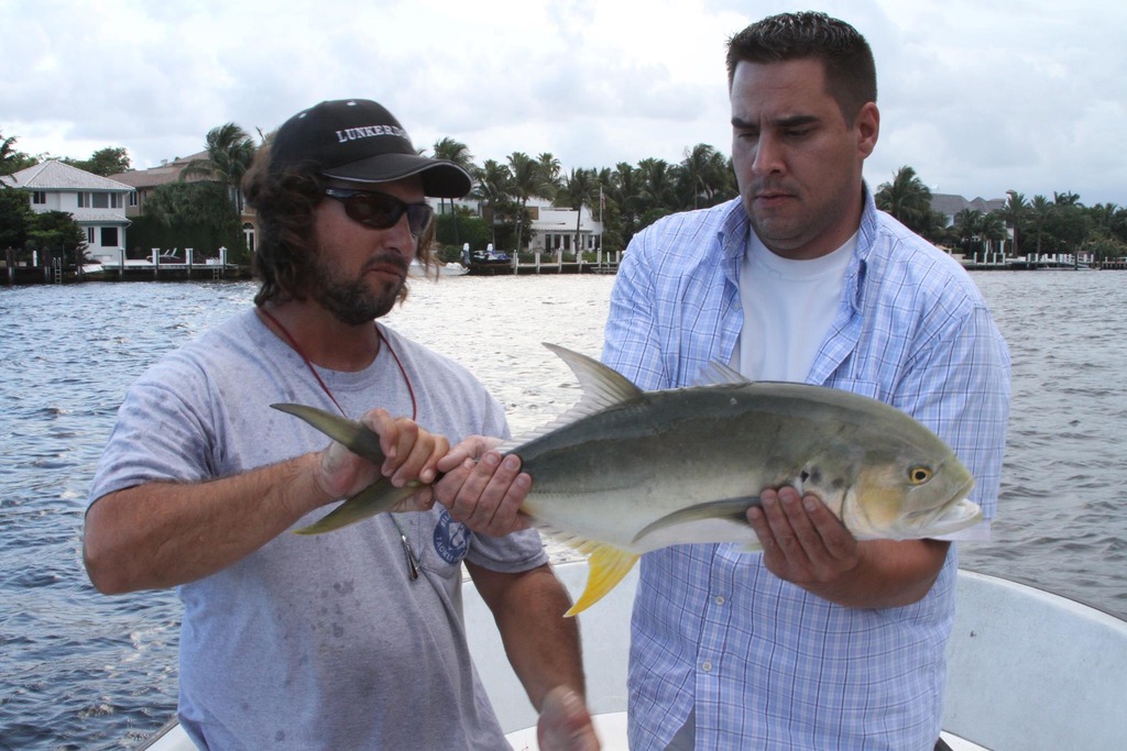 Casual moment of a fisherman with a catch in Boca Raton