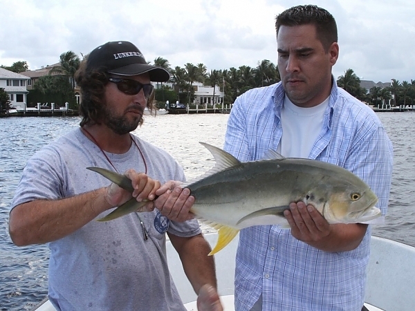 Casual moment of a fisherman with a catch in Boca Raton