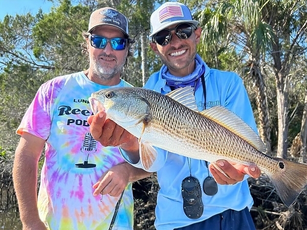 Fisherman with a catch on a Miami beach