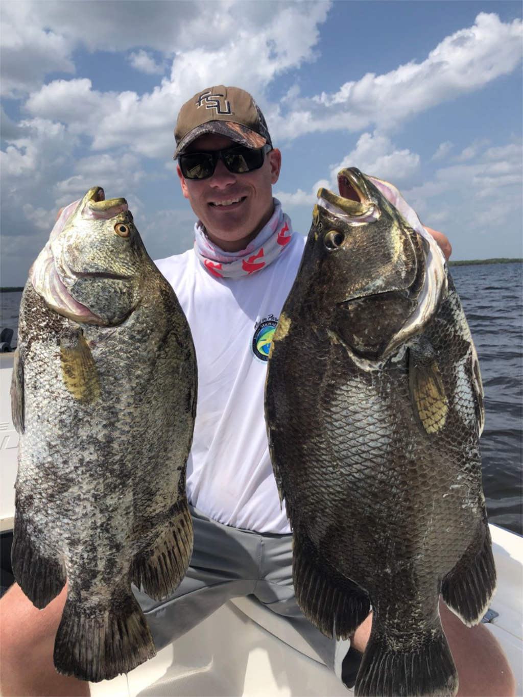 Fisherman with a catch during a Miami fishing trip