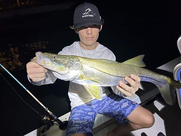 Angler with a catch aboard a boat in Hollywood