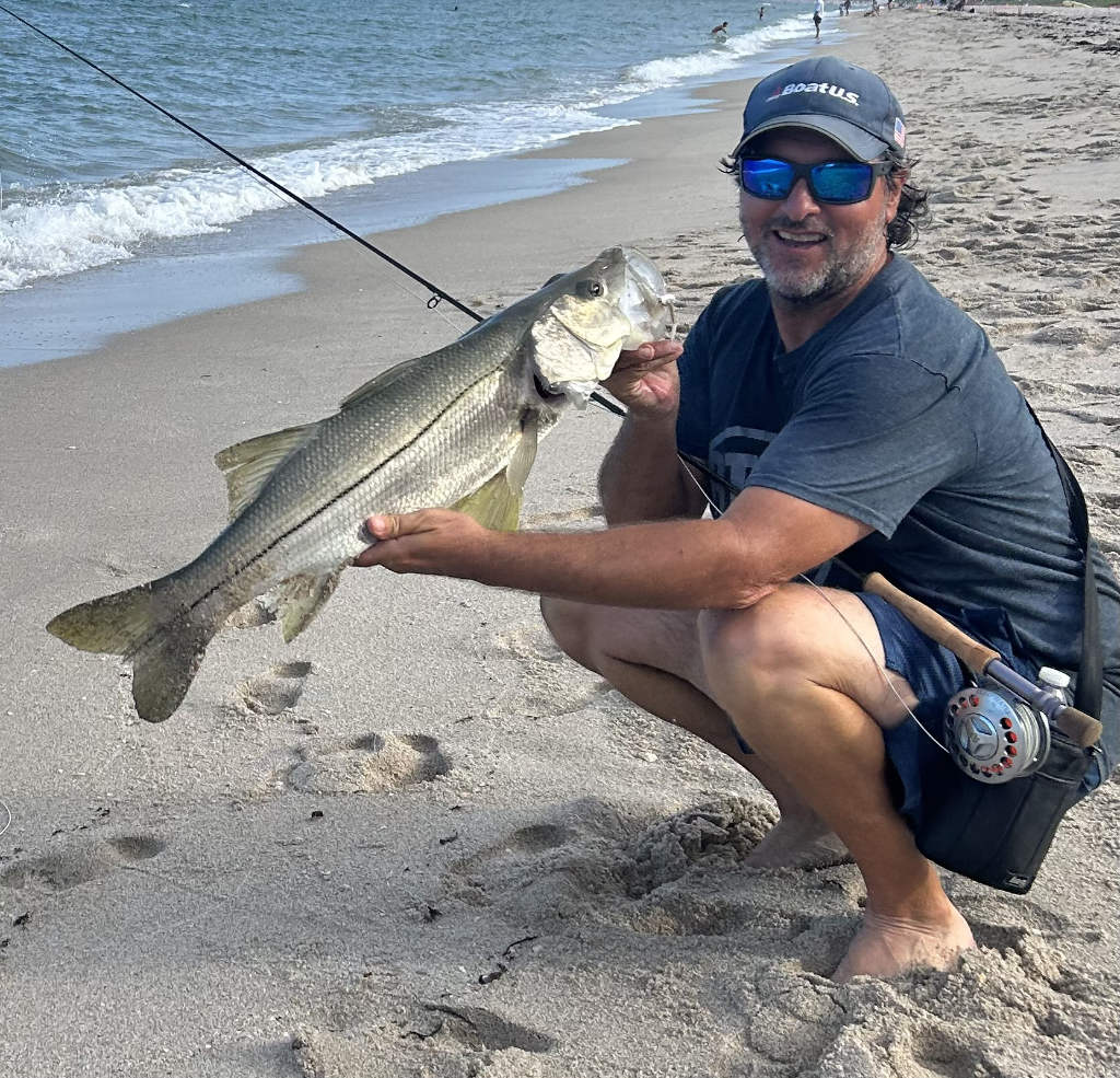 Fisherman with a fresh catch aboard a charter