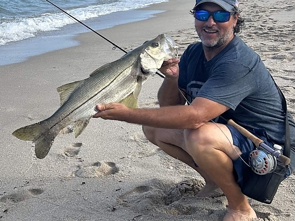 Fisherman with a fresh catch aboard a charter