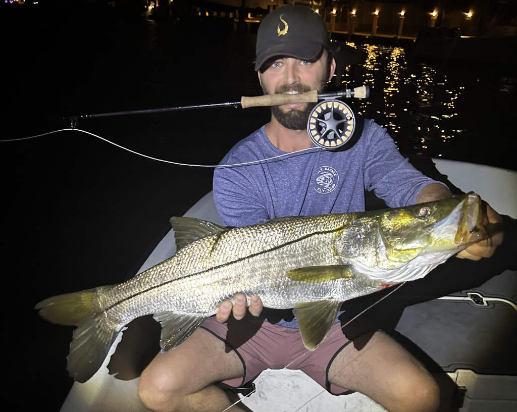 Young boys showcasing their catch on a Fort Lauderdale fishing trip