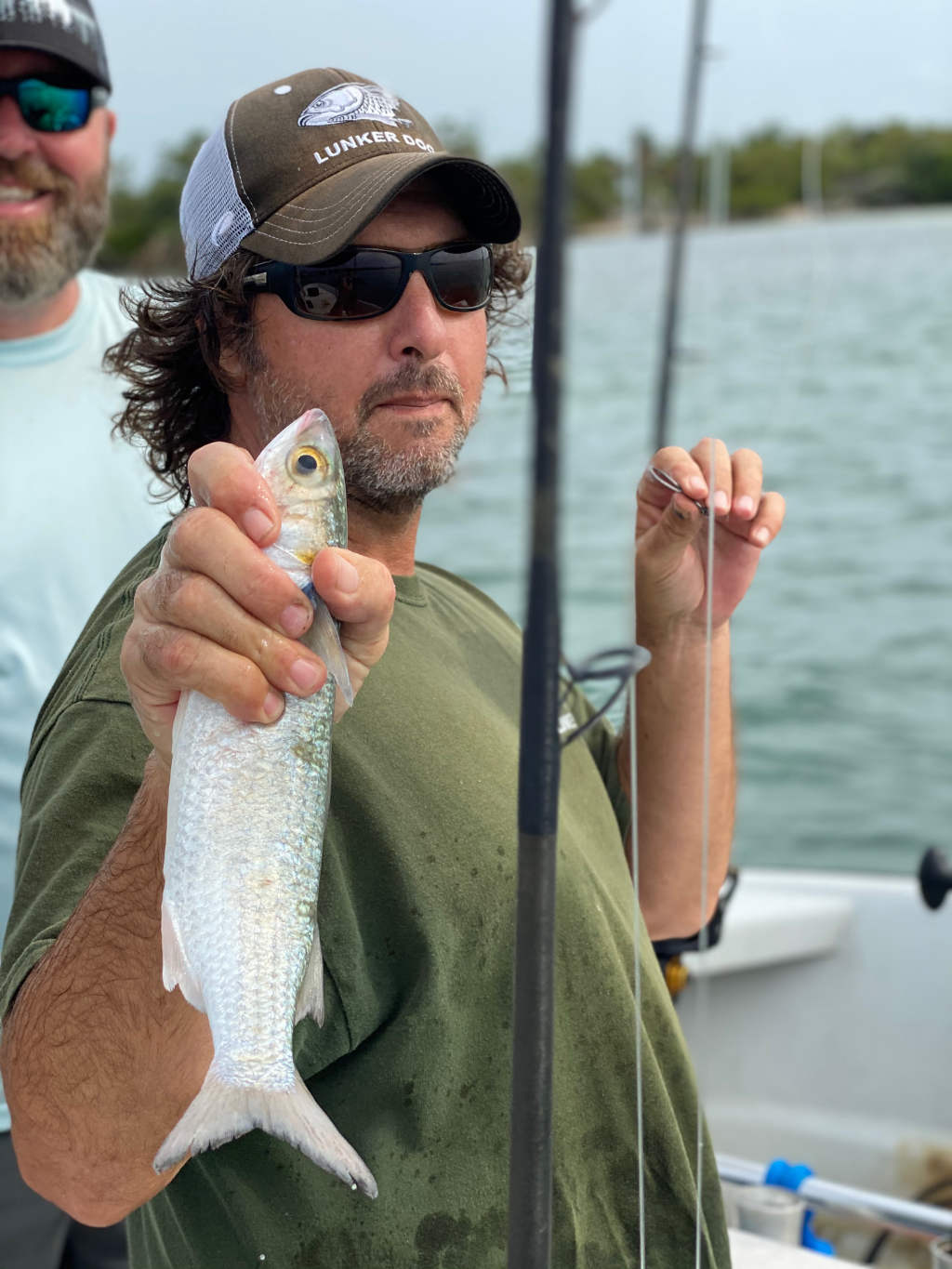 Father and child with their catch on a Fort Lauderdale fishing trip