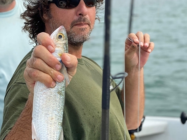 Father and child with their catch on a Fort Lauderdale fishing trip