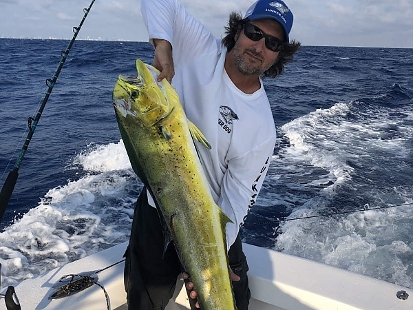 Fisherman with a catch in the ocean waters near Miami