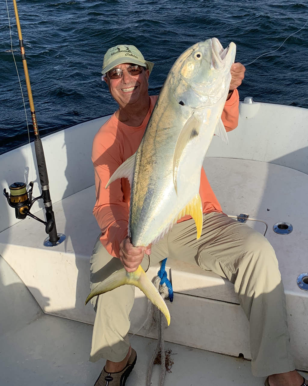 Two fishermen with a large catch in Miami