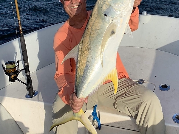 Two fishermen with a large catch in Miami