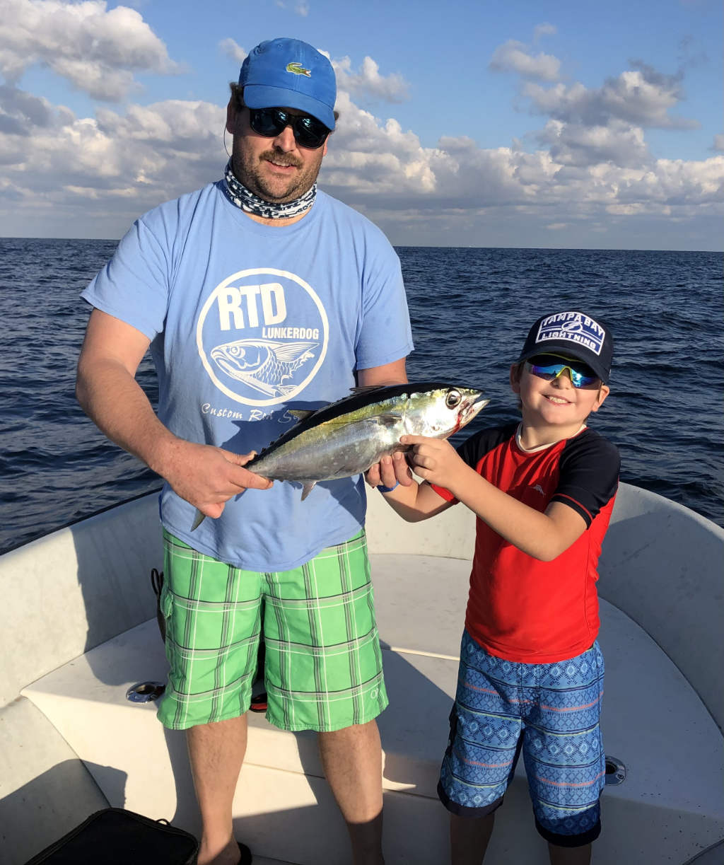 Fisherman with a catch in the vibrant waters of Fort Lauderdale