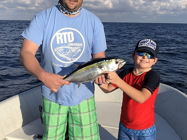 Fisherman with a catch in the vibrant waters of Fort Lauderdale