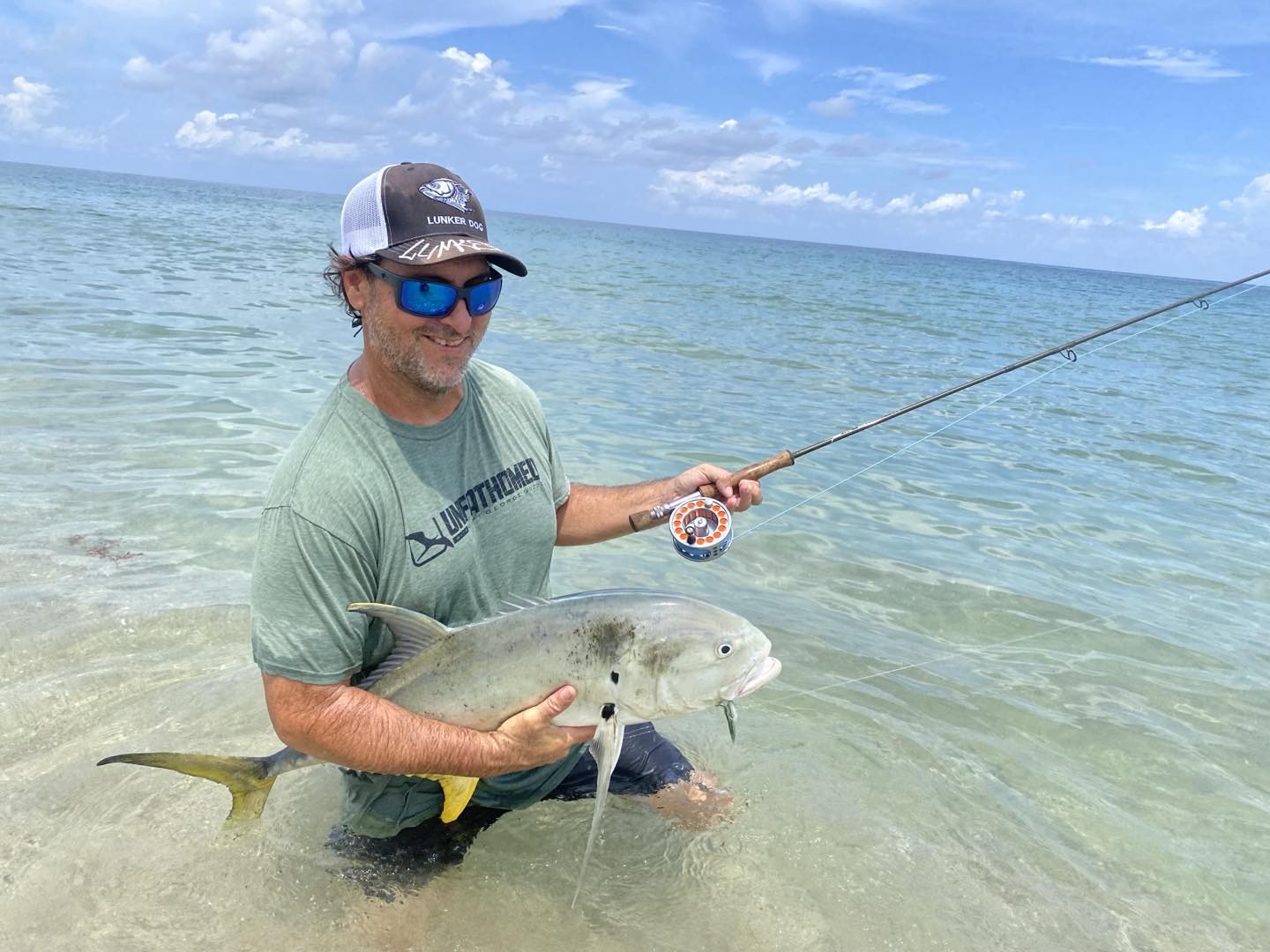 Two anglers with a catch on a Fort Lauderdale fishing trip