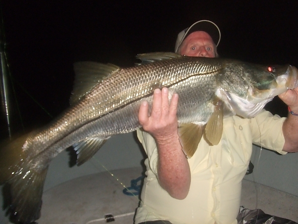 Group celebrating a catch on a Lunkerdog charter in Fort Lauderdale