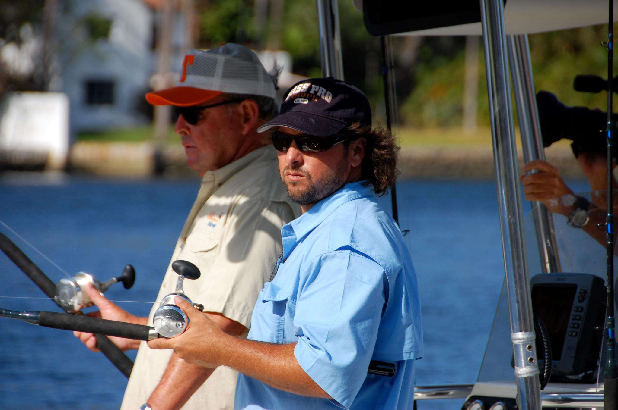 Angler in a boat showing a catch in Fort Lauderdale