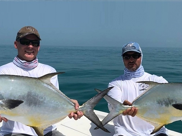 Fisherman in a hat and sunglasses enjoying a fishing trip in Miami